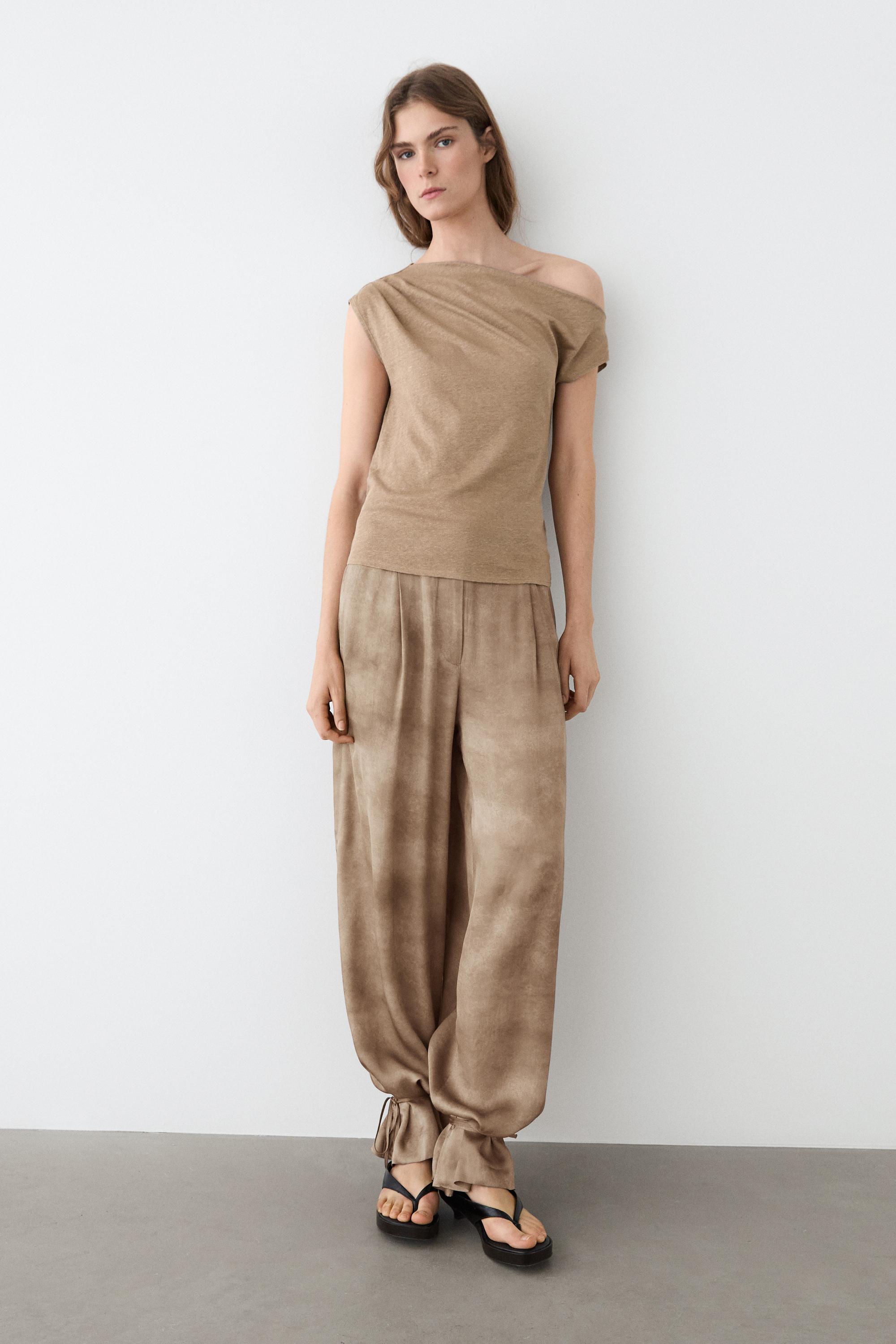 Flowing pants with tie-detail hem